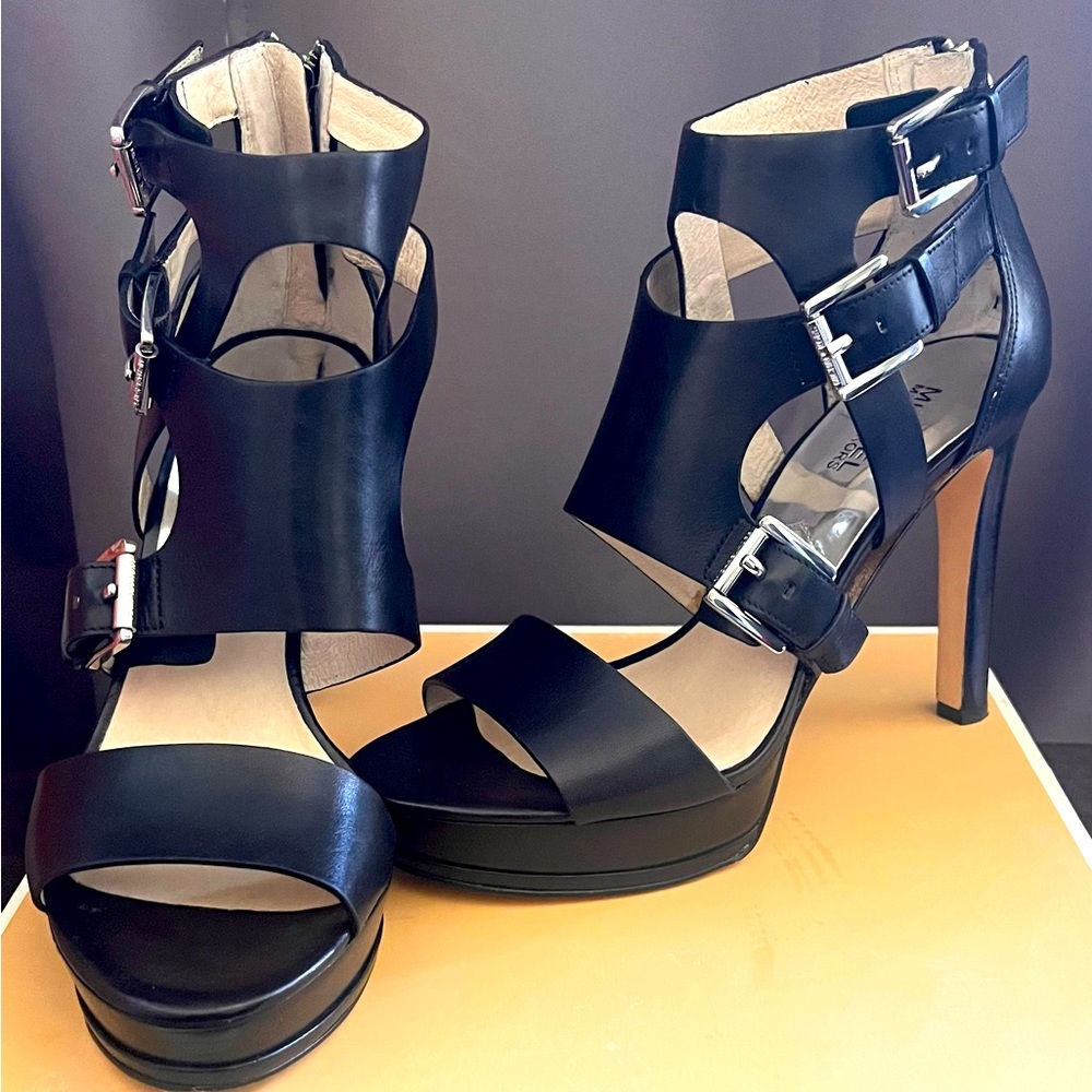 Size 9.5 Michael Kors Black Leather Sandals have a Peep-Toe and 4.50 inch heel.